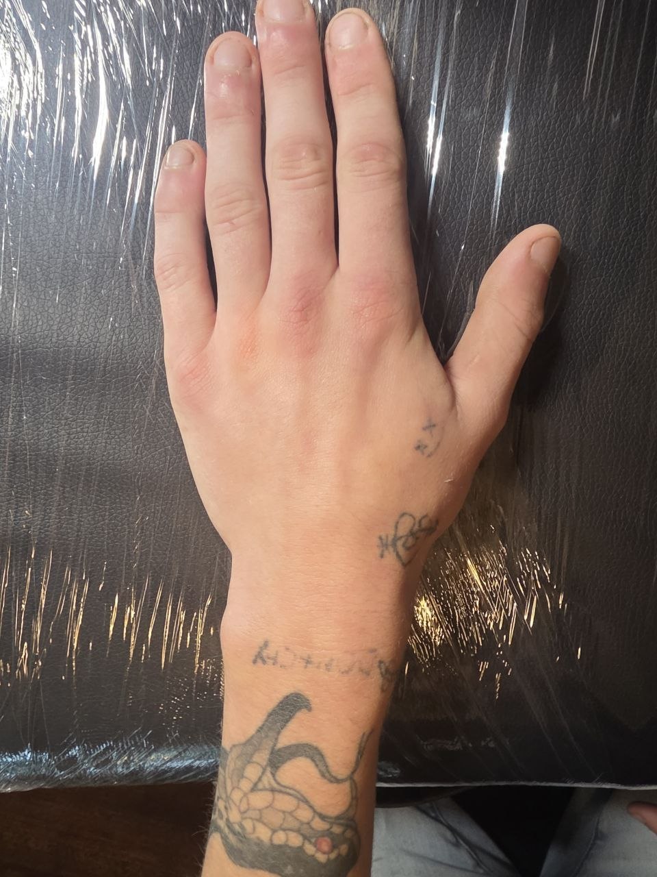 Before: faded hand pokes and lettering